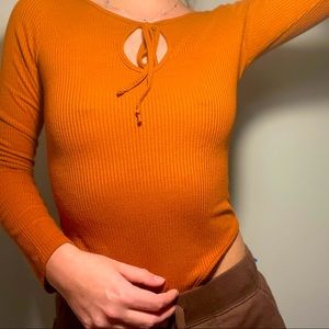 Orange/Brown long sleeve body suit!